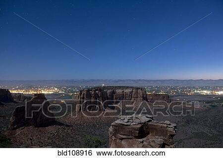 Rock formations in desert valley View Large Photo Image Stock Photograph - Rock formations in desert valley. Fotosearch