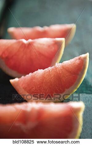 Slices of grapefruit View Large Photo Image Stock Photography - Slices of grapefruit. Fotosearch
