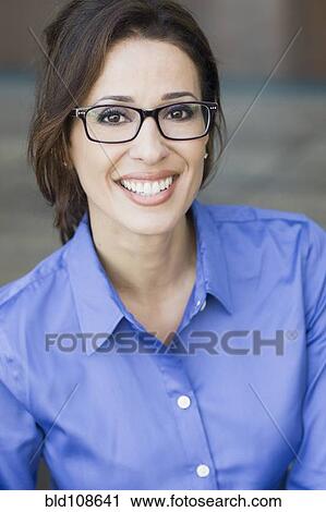 Stock Image - Smiling Hispanic businesswoman. Fotosearch