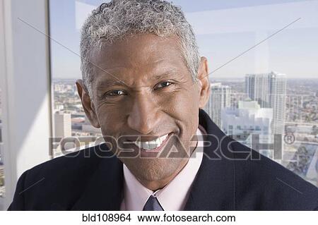 Picture - Smiling mixed race businessman. Fotosearch