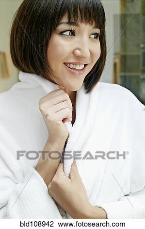 Smiling mixed race woman wrapped in bathrobe View Large Photo Image Stock Image - Smiling mixed race woman wrapped in bathrobe. Fotosearch
