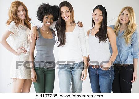 Smiling women standing together View Large Photo Image Stock Photography - Smiling women standing together. Fotosearch