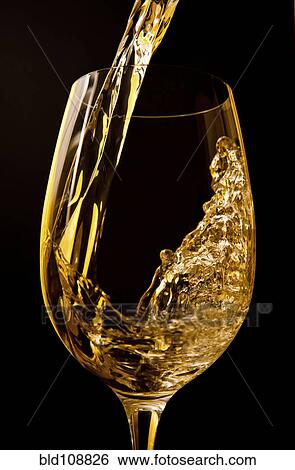 Stock Photograph - Wine pouring into wine glass. Fotosearch