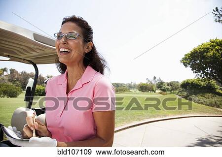Woman keeping score during golf game View Large Photo Image Stock Photo - Woman keeping score during golf game. Fotosearch