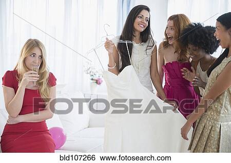 Woman skeptical of friend's new dress View Large Photo Image Stock Photograph - Woman skeptical of friend's new dress. Fotosearch