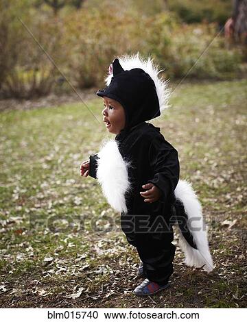 Stock Image - African American baby in skunk costume. Fotosearch