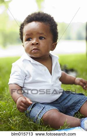 African American baby sitting in grass View Large Photo Image Stock Image - African American baby sitting in grass. Fotosearch