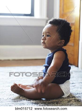 African American baby sitting on floor View Large Photo Image Stock Image - African American baby sitting on floor. Fotosearch