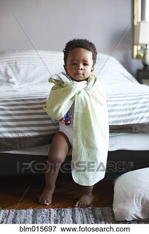 African American boy wrapped in blanket View Large Photo Image Stock Photo - African American boy wrapped in blanket. Fotosearch