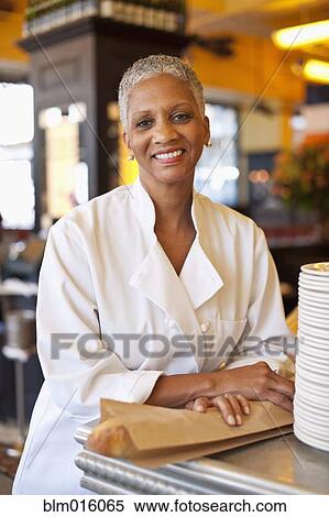 Stock Photography - African American chef in cafe. Fotosearch