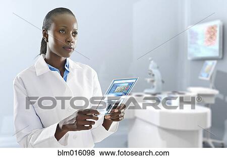 African American doctor using digital tablet in laboratory View Large Photo Image Stock Photo - African American doctor using digital tablet in laboratory. Fotosearch