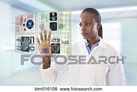 African American doctor using digital display View Large Photo Image Stock Photo - African American doctor using digital display. Fotosearch