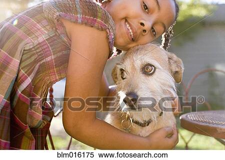 African American girl hugging dog View Large Photo Image Stock Photography - African American girl hugging dog. Fotosearch