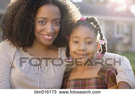 African American mother and daughter hugging View Large Photo Image Stock Image - African American mother and daughter hugging. Fotosearch