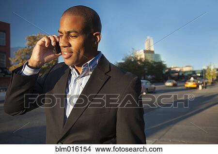 Black businessman talking on cell phone View Large Photo Image Picture - Black businessman talking on cell phone. Fotosearch