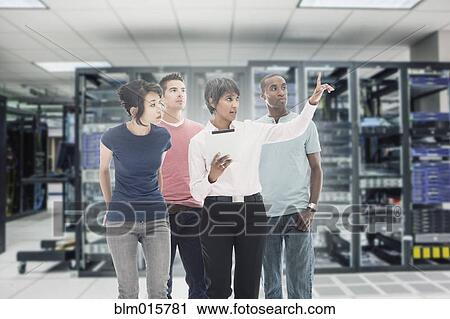 Business people working in server room View Large Photo Image Stock Image - Business people working in server room. Fotosearch