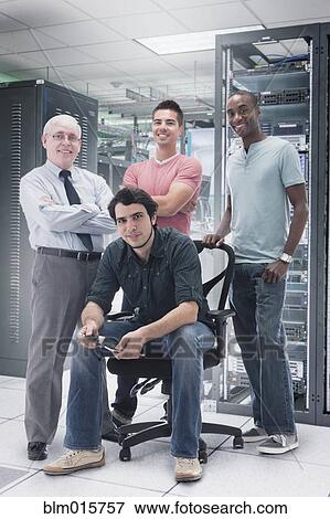 Businessmen in server room View Large Photo Image Stock Photo - Businessmen in server room. Fotosearch