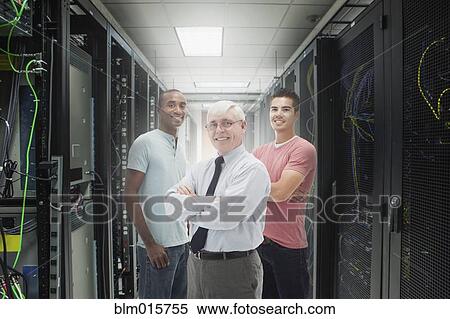 Businessmen standing in server room View Large Photo Image Stock Photography - Businessmen standing in server room. Fotosearch