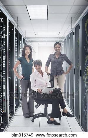 Stock Photo - Businesswomen in server room. Fotosearch