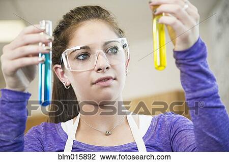Caucasian student working with chemicals in classroom View Large Photo Image Stock Image - Caucasian student working with chemicals in classroom. Fotosearch