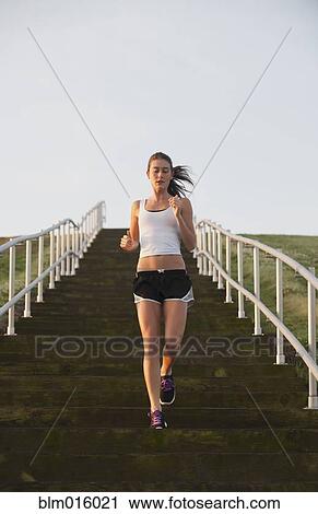 Caucasian woman running down steps View Large Photo Image Stock Image - Caucasian woman running down steps. Fotosearch