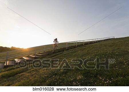 Caucasian woman running up steps View Large Photo Image Stock Photo - Caucasian woman running up steps. Fotosearch
