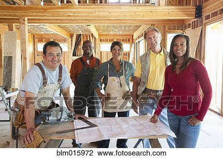 Construction workers in unfinished room View Large Photo Image Stock Image - Construction workers in unfinished room. Fotosearch
