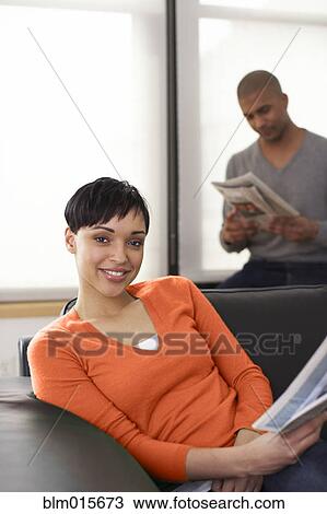 Couple relaxing and reading newspapers View Large Photo Image Stock Image - Couple relaxing and reading newspapers. Fotosearch