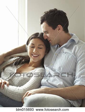 Stock Image - Couple relaxing together. Fotosearch