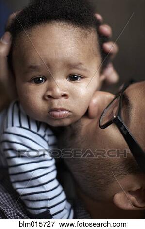 Father kissing African American baby View Large Photo Image Stock Photo - Father kissing African American baby. Fotosearch
