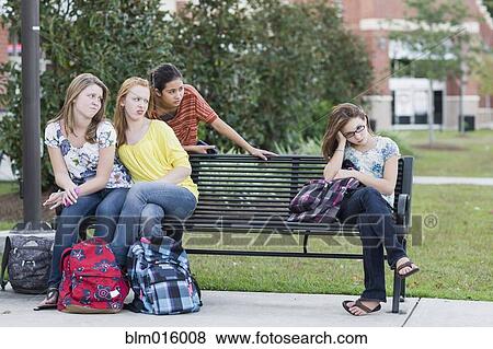 Stock Photo - Girl being rejected by other girls. Fotosearch