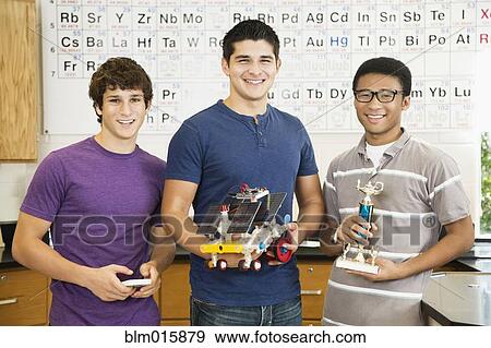 High school students holding solar powered machine and trophy View Large Photo Image Stock Photo - High school students holding solar powered machine and trophy. Fotosearch