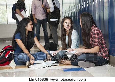 High school students sitting in corridor together View Large Photo Image Stock Photo - High school students sitting in corridor together. Fotosearch