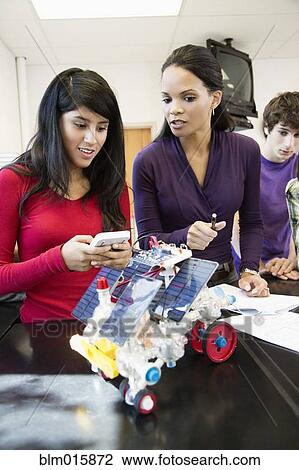High school students working on solar powered machine in classroom View Large Photo Image Stock Image - High school students working on solar powered machine in classroom. Fotosearch