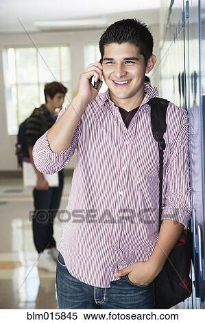 Hispanic high school student talking on cell phone View Large Photo Image Stock Photography - Hispanic high school student talking on cell phone. Fotosearch