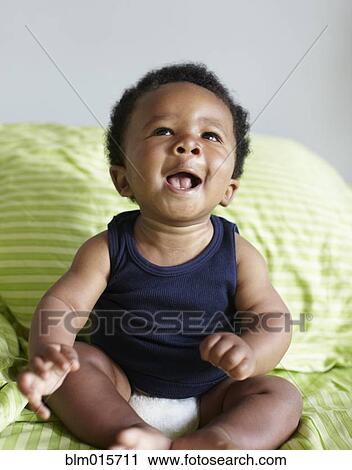 Stock Image - Laughing African American baby. Fotosearch