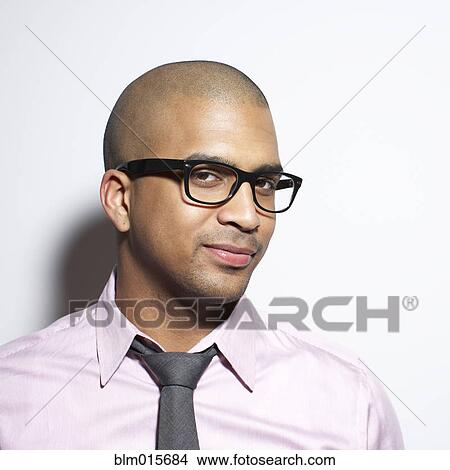 Serious businessman in eyeglasses View Large Photo Image Picture - Serious businessman in eyeglasses. Fotosearch