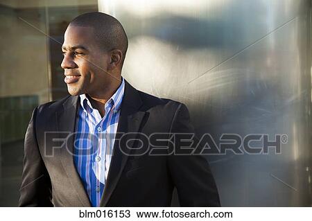 Stock Image - Smiling Black businessman. Fotosearch