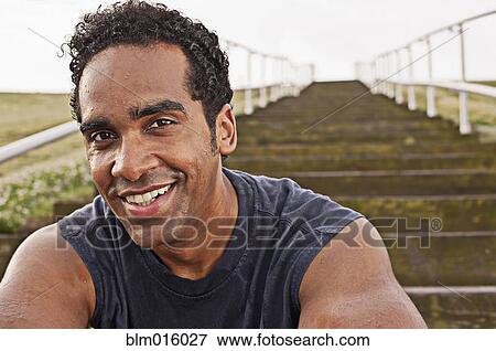 Stock Photo - Smiling mixed race man. Fotosearch