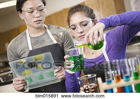 Students working with chemicals in classroom View Large Photo Image Stock Image - Students working with chemicals in classroom. Fotosearch