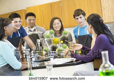 Teacher explaining chemistry model to students View Large Photo Image Stock Photo - Teacher explaining chemistry model to students. Fotosearch