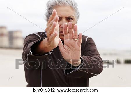 Woman exercising outdoors View Large Photo Image Stock Image - Woman exercising outdoors. Fotosearch