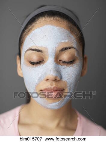 Stock Photo - Woman with facial mask. Fotosearch