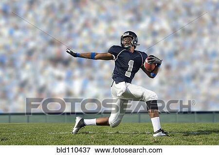 African American football player poised on field View Large Photo Image Stock Photo - African American football player poised on field. Fotosearch