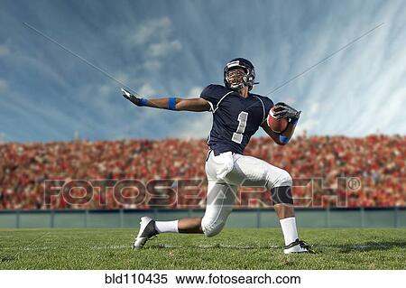 African American football player poised on field View Large Photo Image Stock Photography - African American football player poised on field. Fotosearch