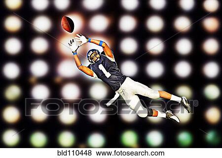 African American football player catching ball View Large Photo Image Stock Photo - African American football player catching ball. Fotosearch