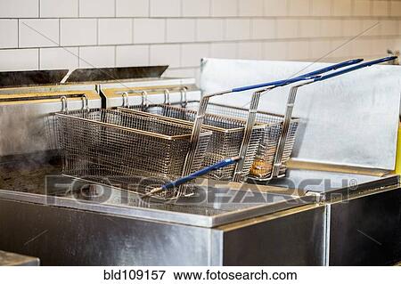 Baskets on deep fat fryer in restaurant View Large Photo Image Stock Photo - Baskets on deep fat fryer in restaurant. Fotosearch