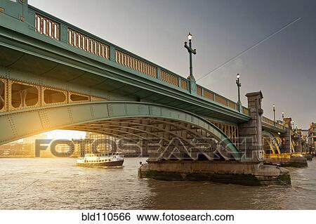 Boat and urban bridge View Large Photo Image Stock Photograph - Boat and urban bridge. Fotosearch