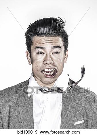 Stock Photo - Businessman making face in wind. Fotosearch