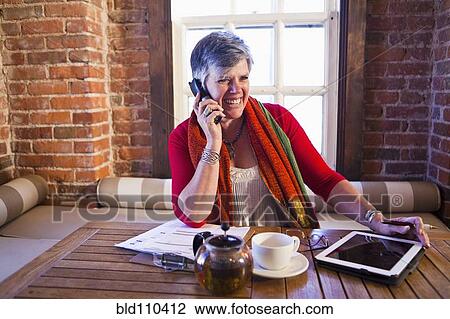 Caucasian businesswoman working in cafe View Large Photo Image Stock Image - Caucasian businesswoman working in cafe. Fotosearch